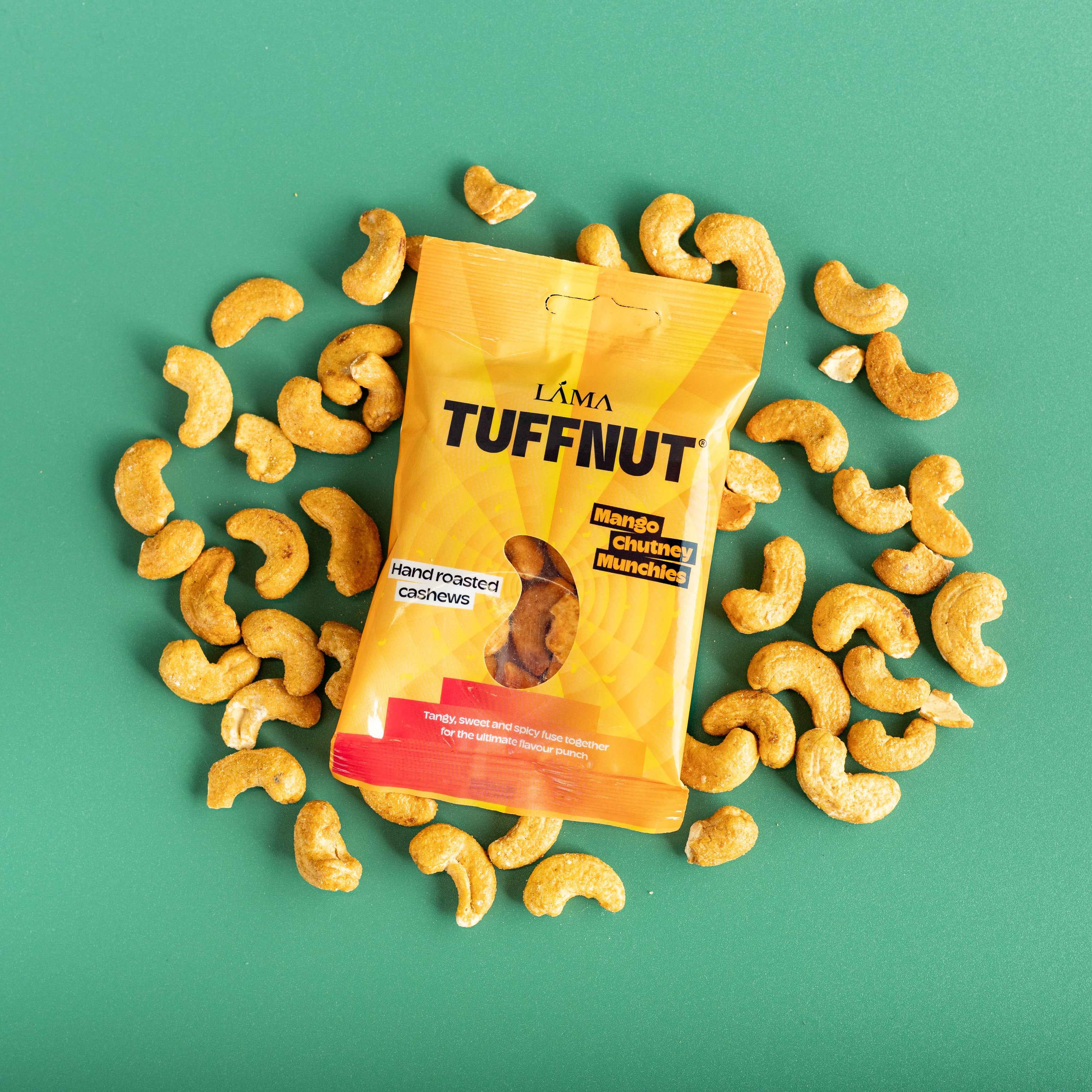 Packaged snack with cashews on a green background